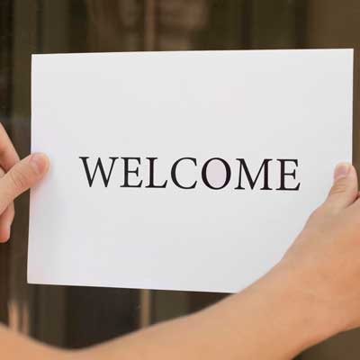 Welcome sign being put up